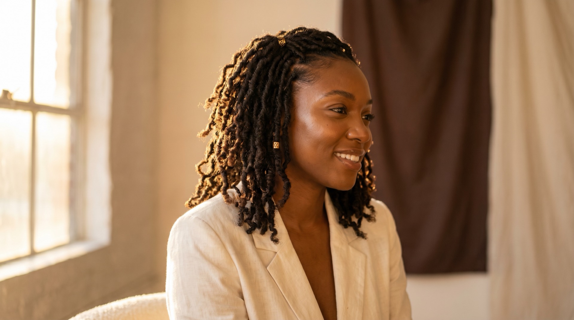 Client with healthy, beautifully styled locs at Kinkology in Atlanta